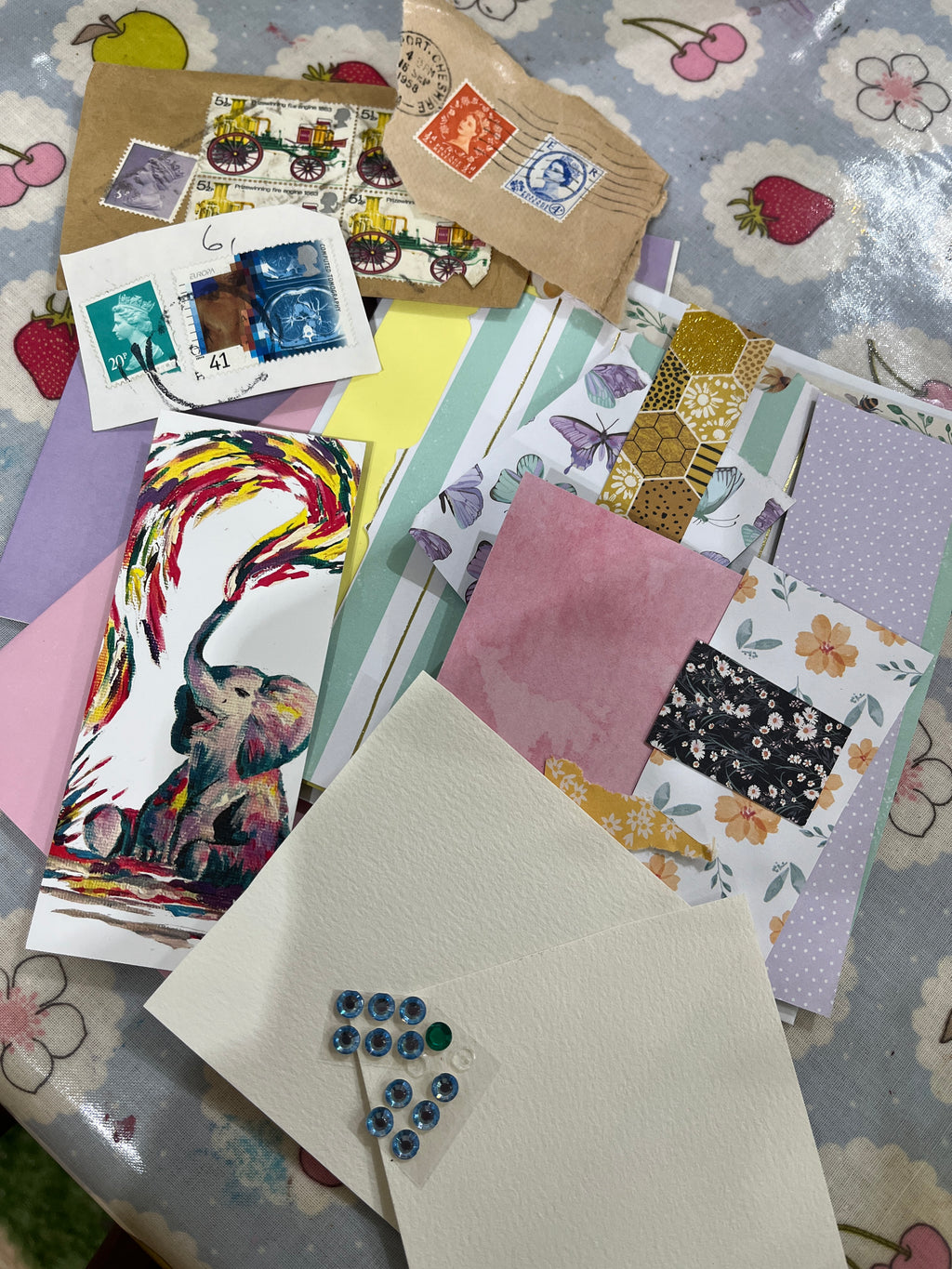 card making craft set, scrap card stickers & stamps layed out on a table with stamps and a picture of an elephant squirting colourful paint by jj barrs