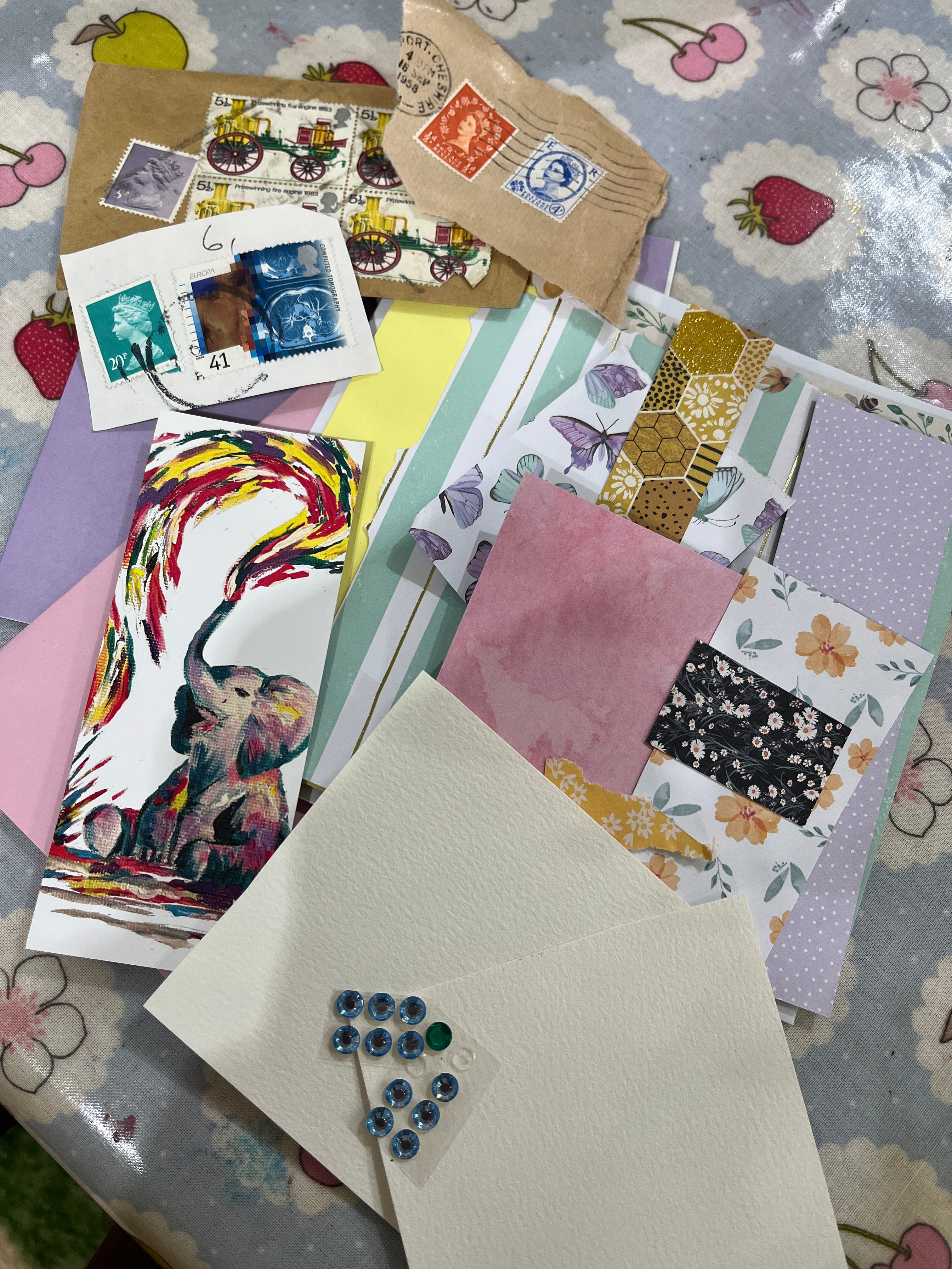 card making craft set, scrap card stickers & stamps layed out on a table with stamps and a picture of an elephant squirting colourful paint by jj barrs