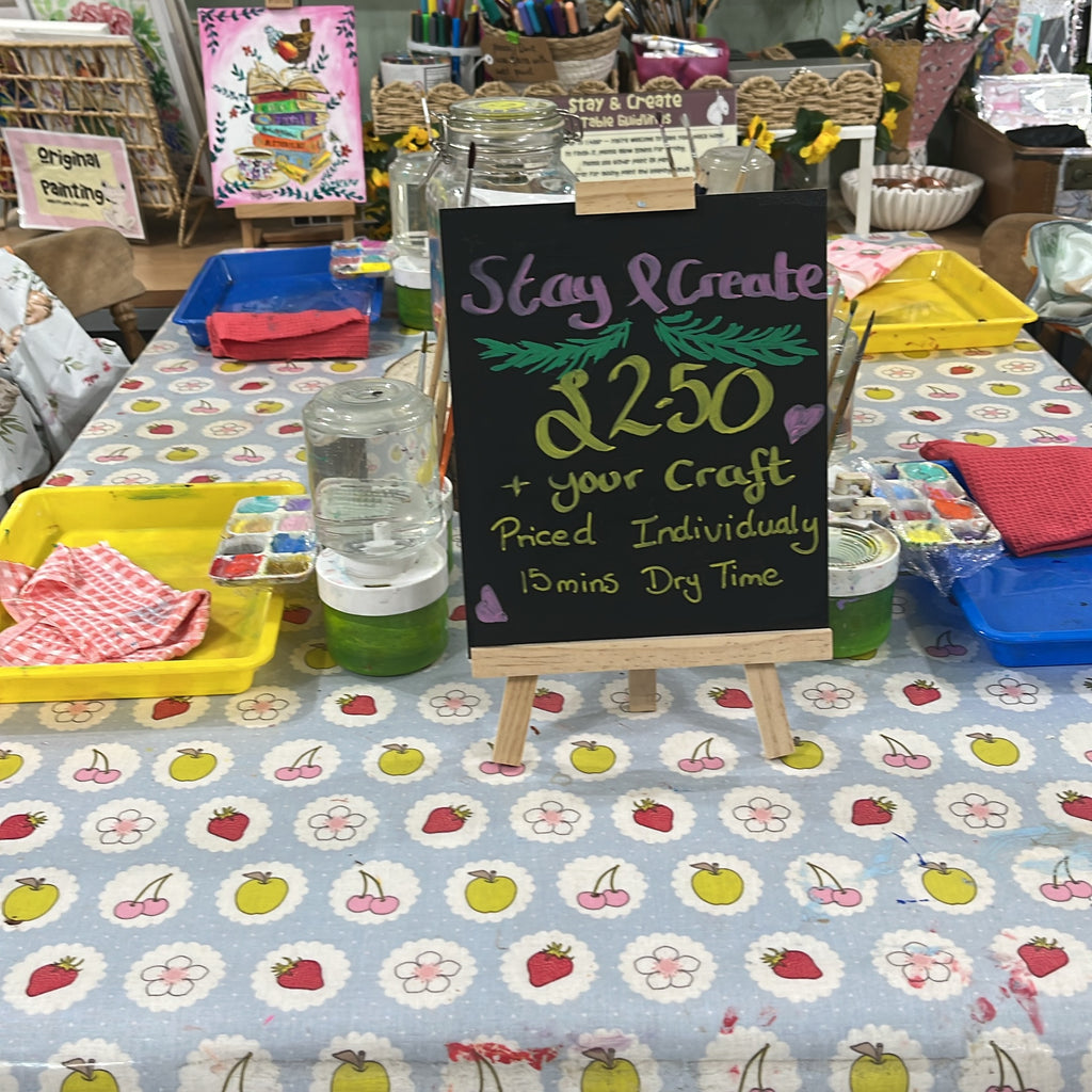 stay and create sign on a crafting table at the wild fig and fern